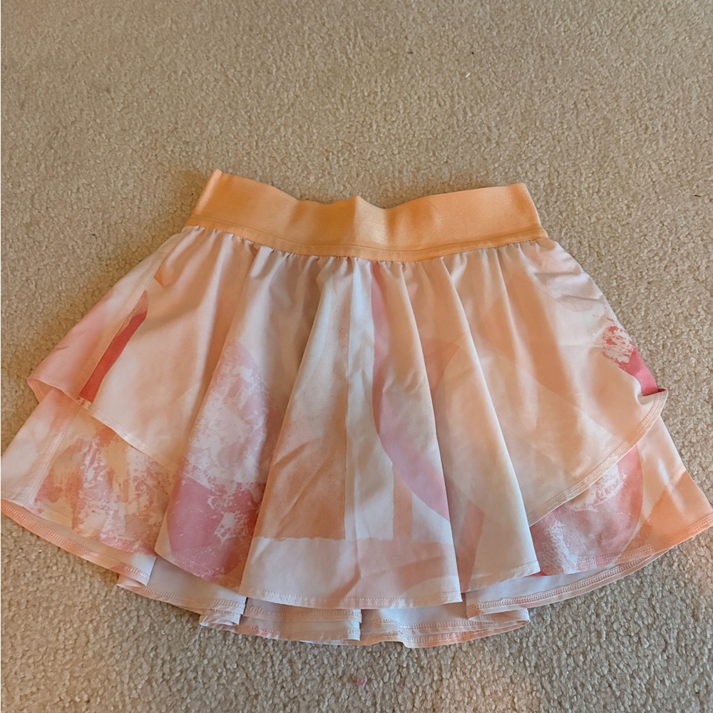 RARE Lululemon orange and pink skirt with built in shorts. Size: 4